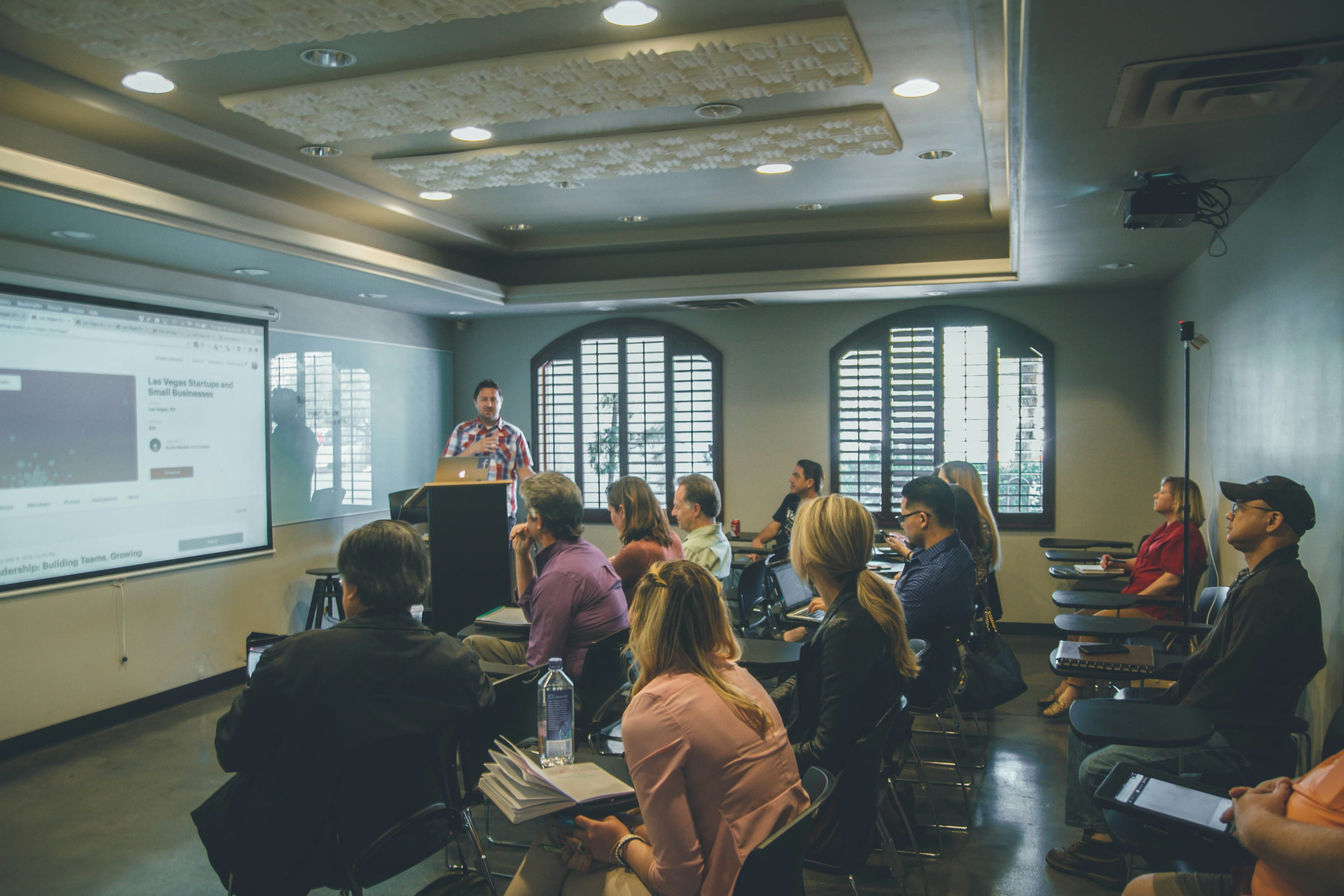 Students attending a lecture in a bright classroom