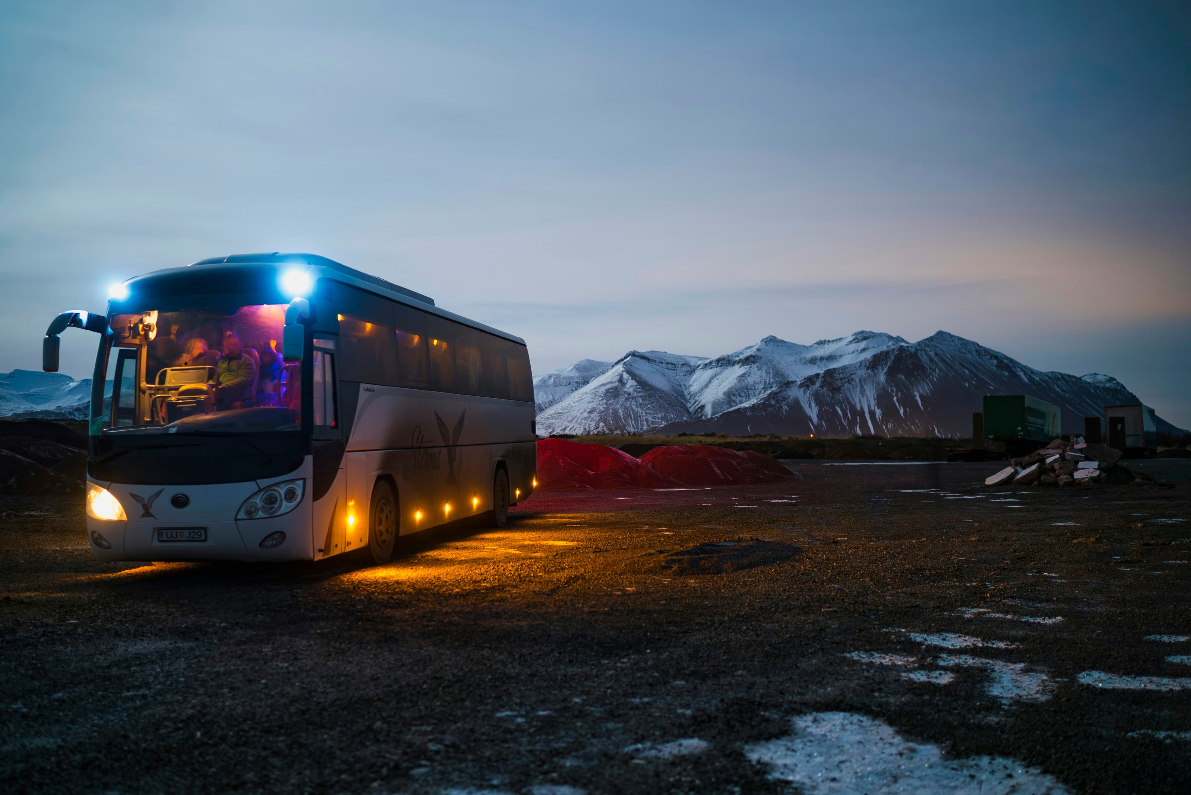 A bus on a highway at dusk (representative image)